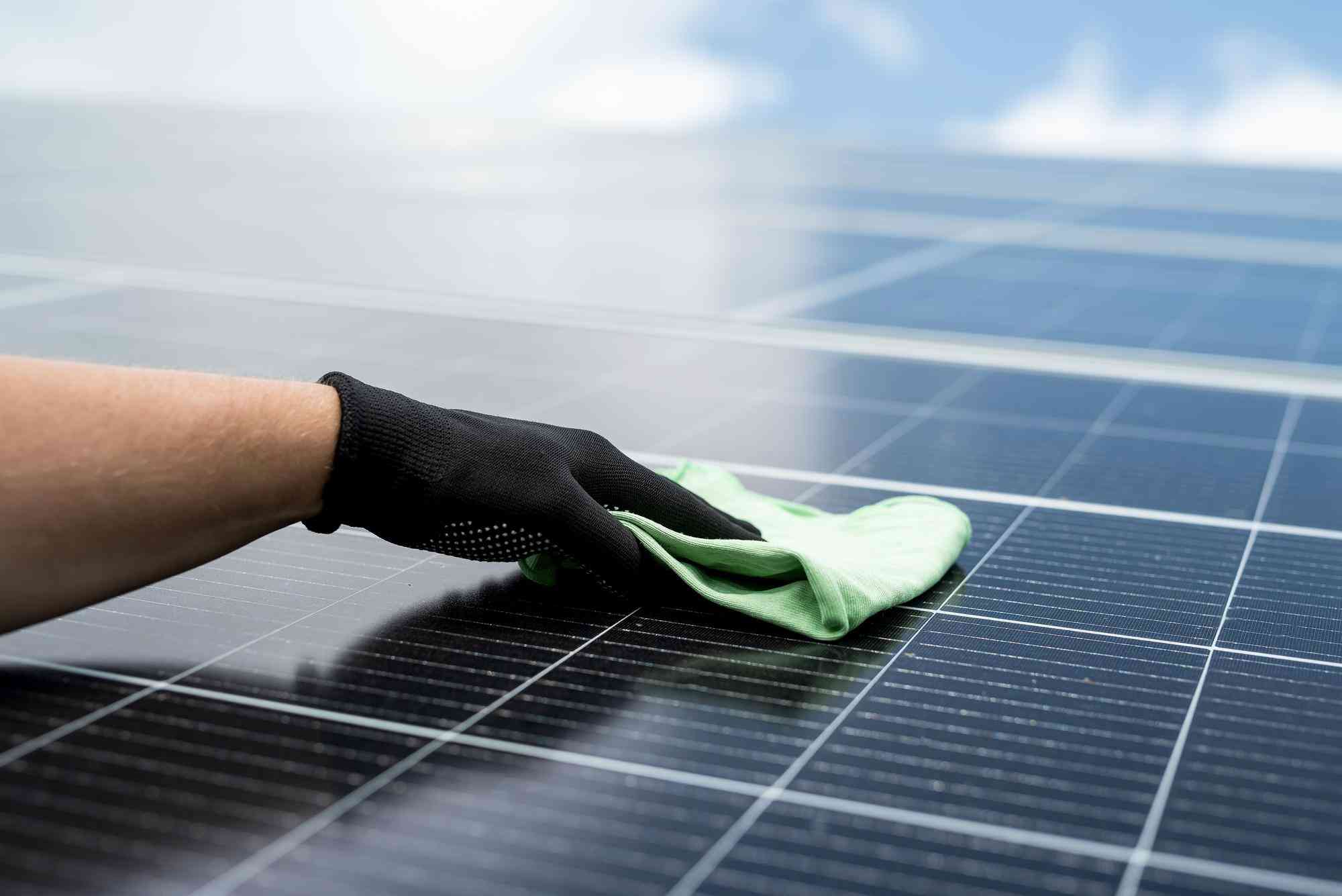 Wiping a solar panel with a microfibre cloth